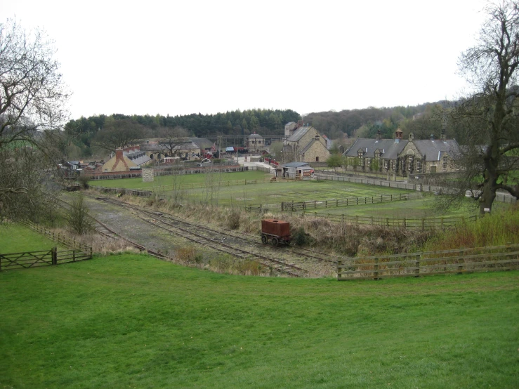 train yard with various railroad tracks and buildings