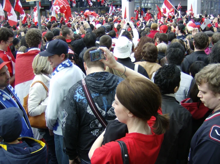 a group of people standing around each other