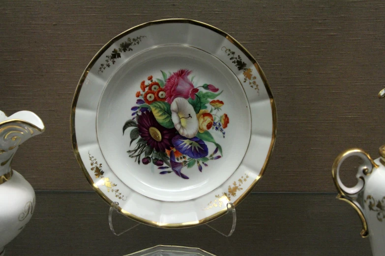 a china dish with flowers painted on it