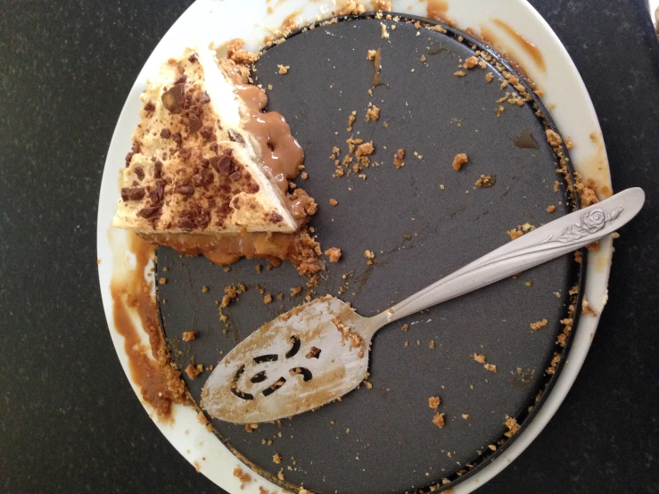 there is a partially eaten slice of cake on the plate