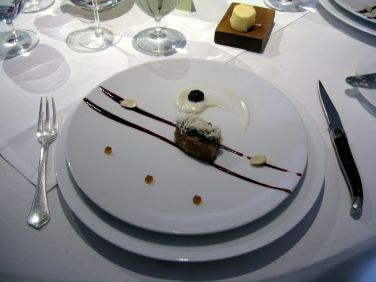 a plate with some dessert on it next to a fork