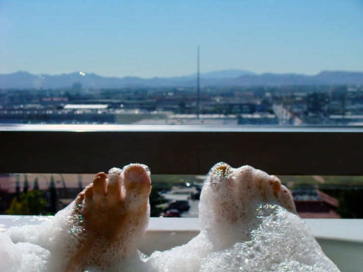 a person has their feet in the tub