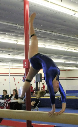 an individual in an action pose on a high bar