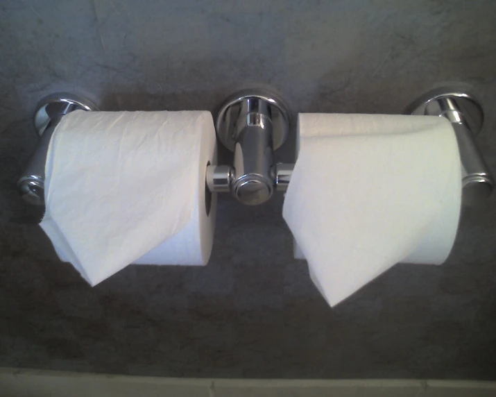 the two towels are hanging up in a bathroom