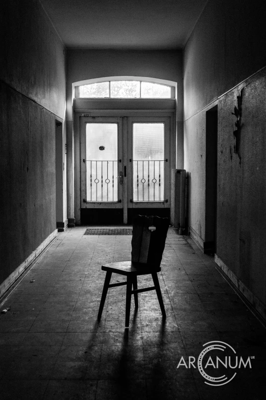 a chair and a hallway near a door