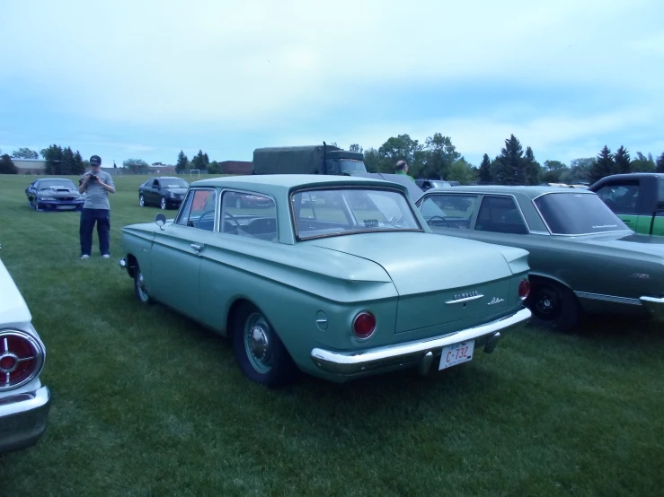 an older car is on display at a show