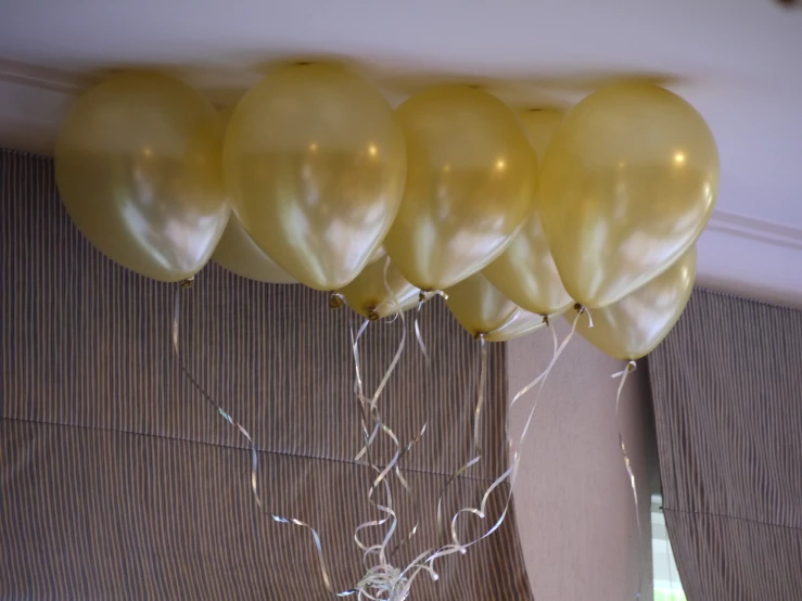 an image of a number of balloons hanging in the air