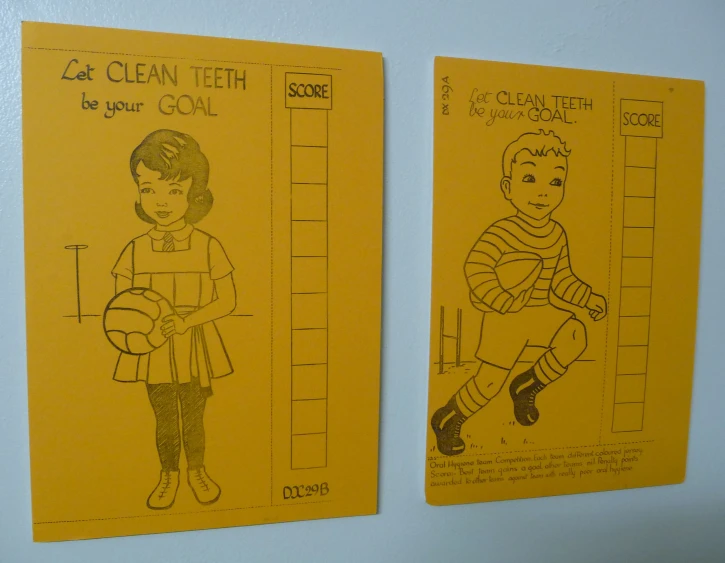 two children's safety checks hanging on the wall