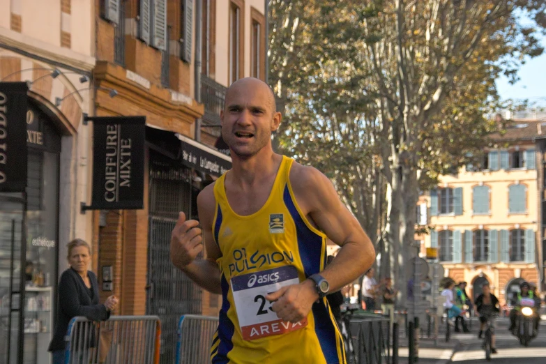 a male marathon runner in the middle of a run