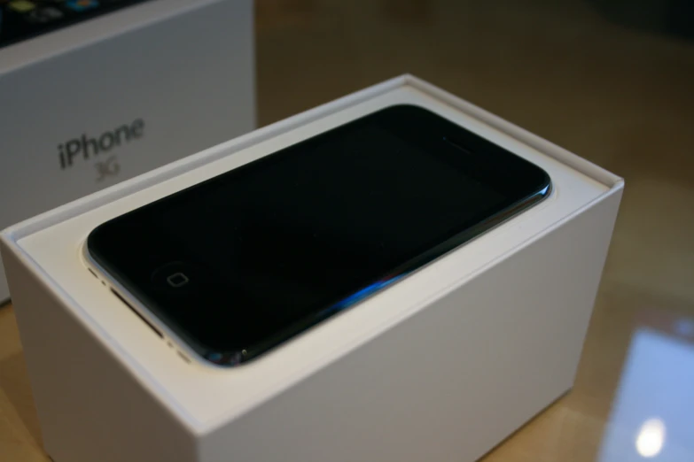 an iphone in its box on top of a table