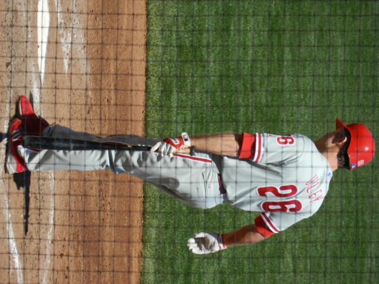 a man on a baseball field holding a bat