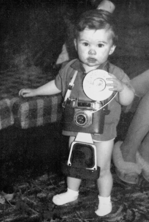 black and white image of a baby with camera