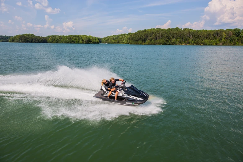 two people in the water on a boat