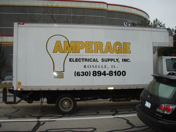 a large white truck parked on the side of the street