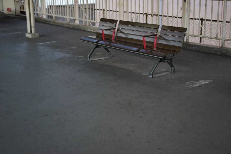 a bench in the middle of a parking lot