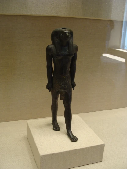 a statue is on display at a museum