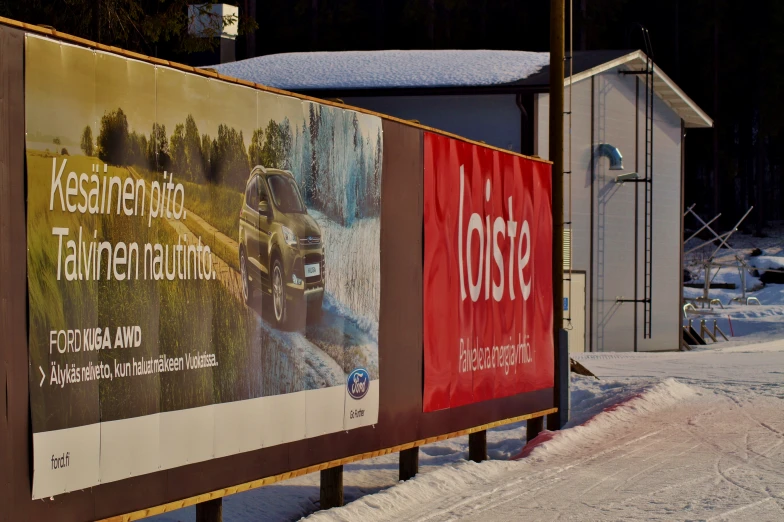 three billboards displaying various locations that appear to be snow covered