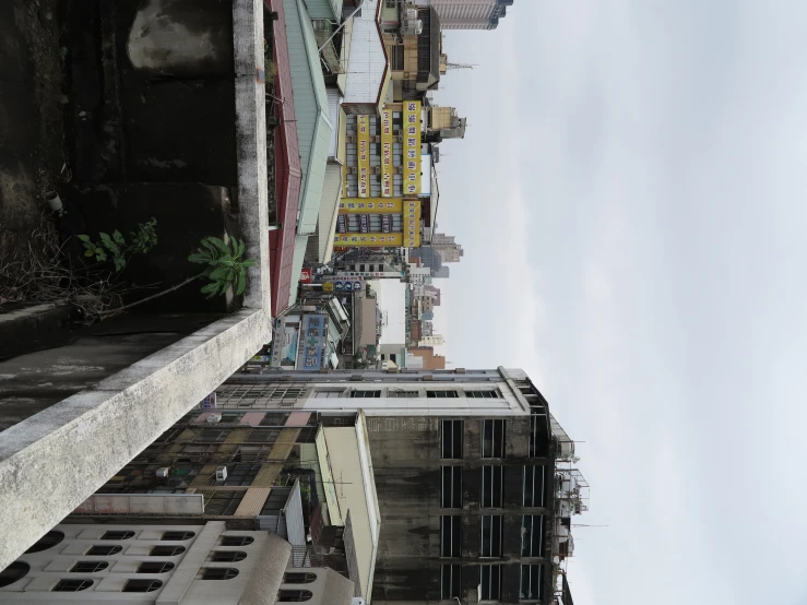 an urban area with many tall buildings and rooftops