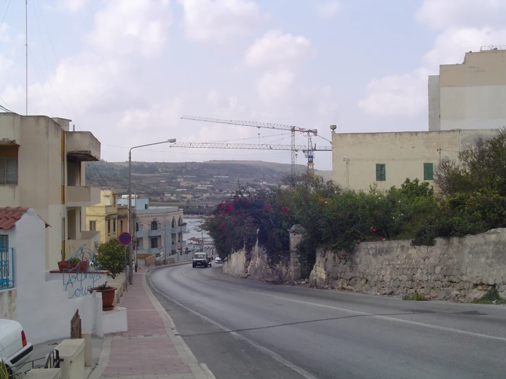 a large street lined with houses on both sides