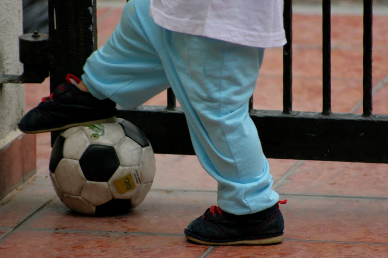 this is a picture of someone's feet on a soccer ball