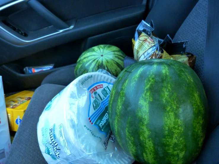 there are some fruit sitting in the car seat