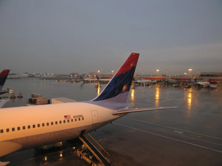 an airport tarmac with several planes parked at terminals