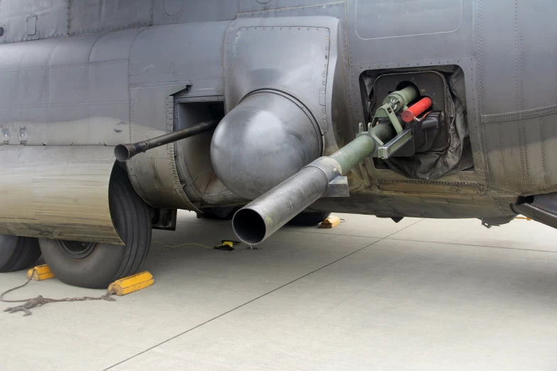 a military plane sitting on the tarmac