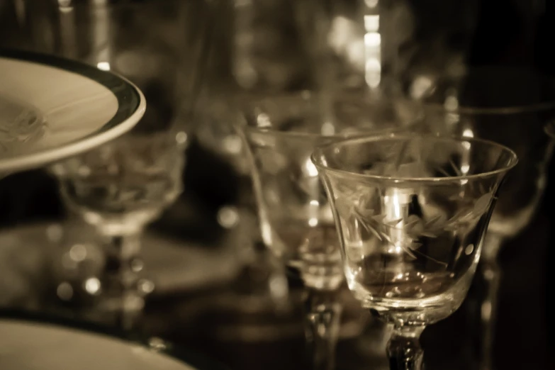 glassware on a table, many are empty