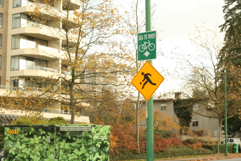 a sign in front of some buildings and trees