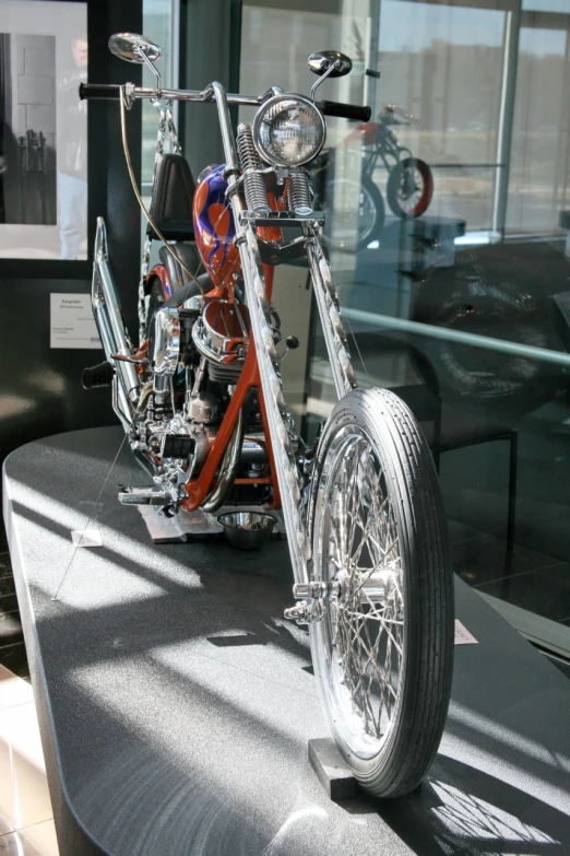 a motorcycle is sitting on display on a table