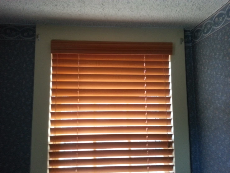 there is a window with an open blind next to it