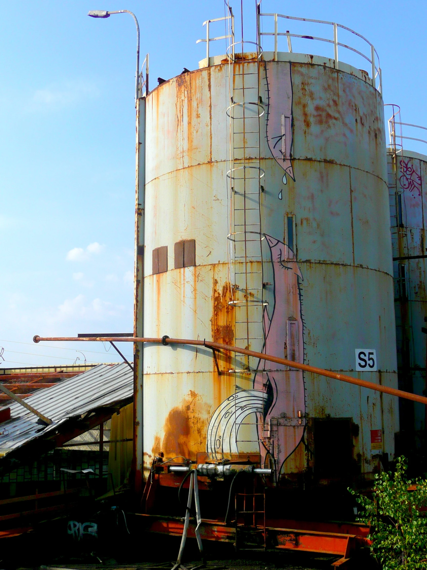 a tall building with a lot of graffiti on it's side