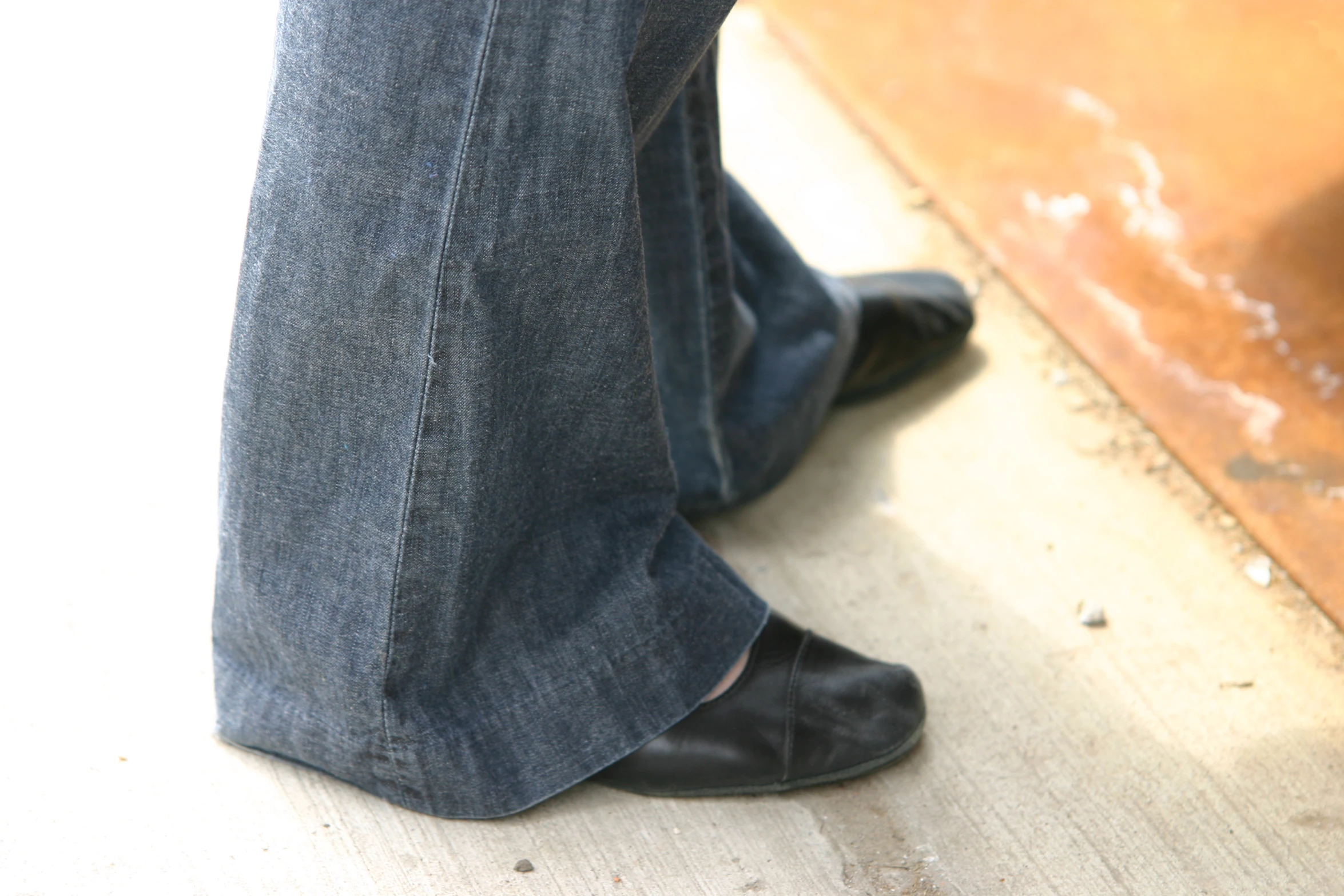 an image of a persons legs standing with the ground in front