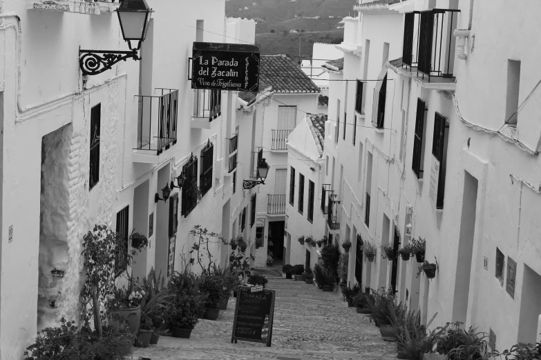 an empty street with buildings and a few windows