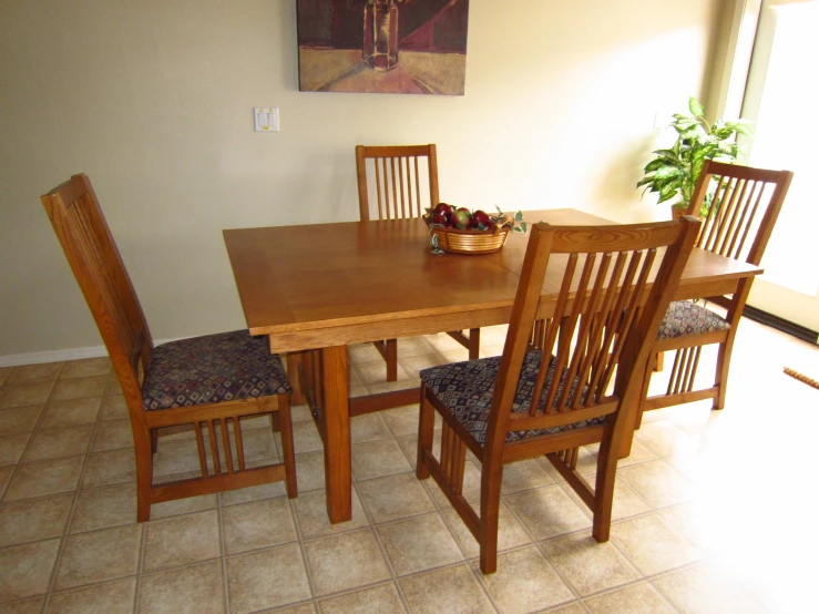 the wooden table is set up for four people