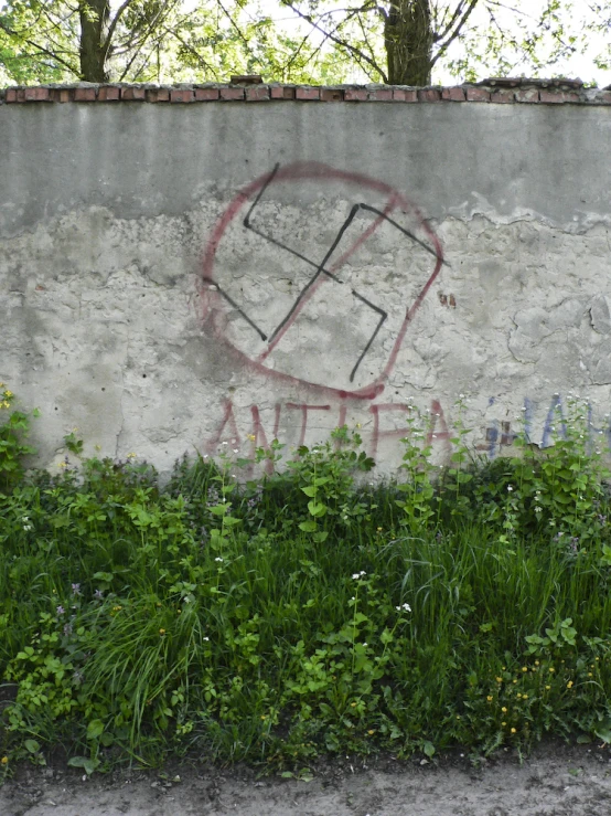 graffiti is shown on the side of a wall