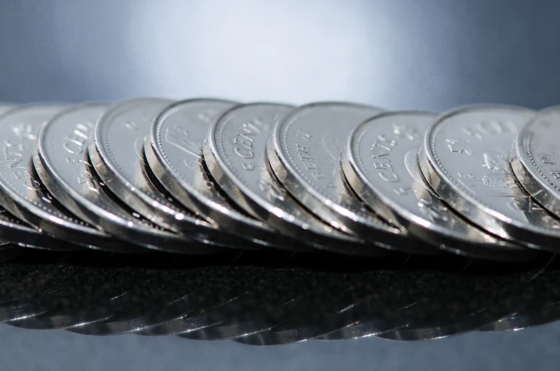 a stack of ten silver twenty - fivepence coins