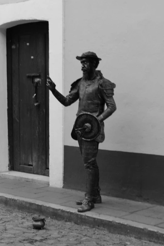 a black and white po of a man wearing a hat