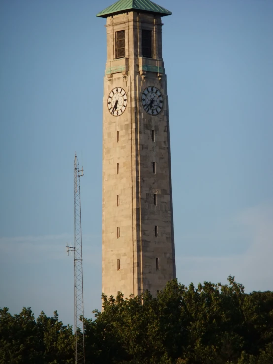 a tall building with a clock tower above it