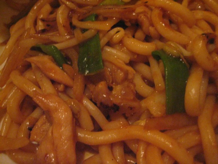 some noodles and vegetables are piled up together