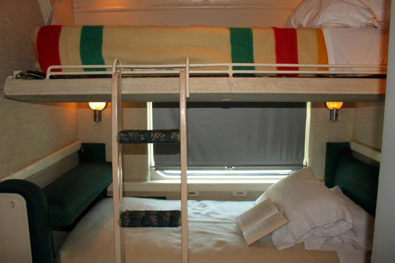 the room has two bunk beds with two pillows