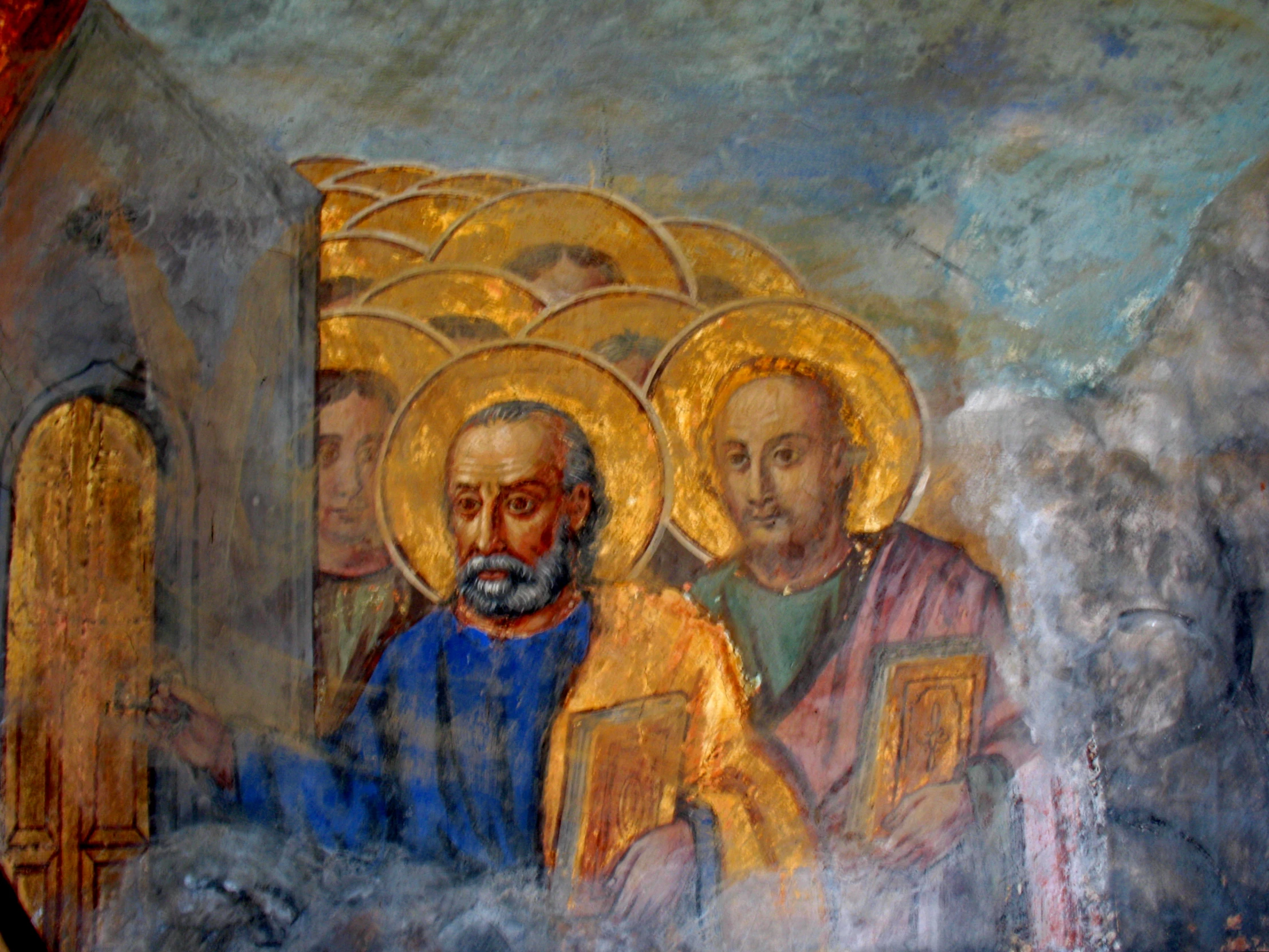 two painting of men sitting next to each other in a church