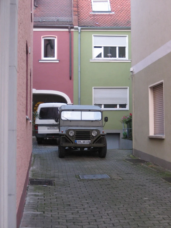 a truck parked in the street in front of a building