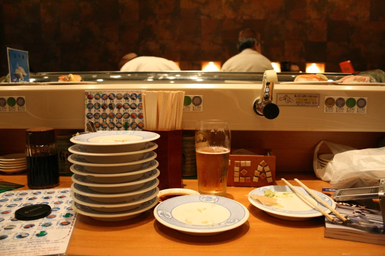 plates and glasses sitting next to each other on a counter