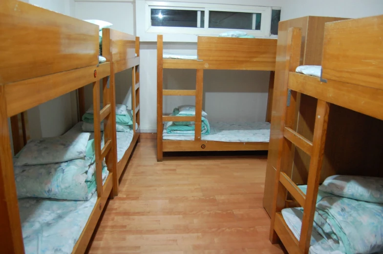 the bunk beds are neatly arranged in a room