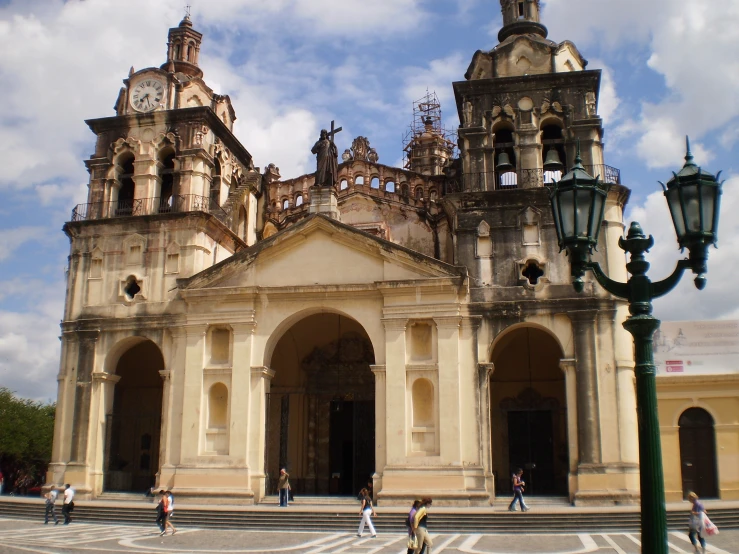 an image of people going around a church