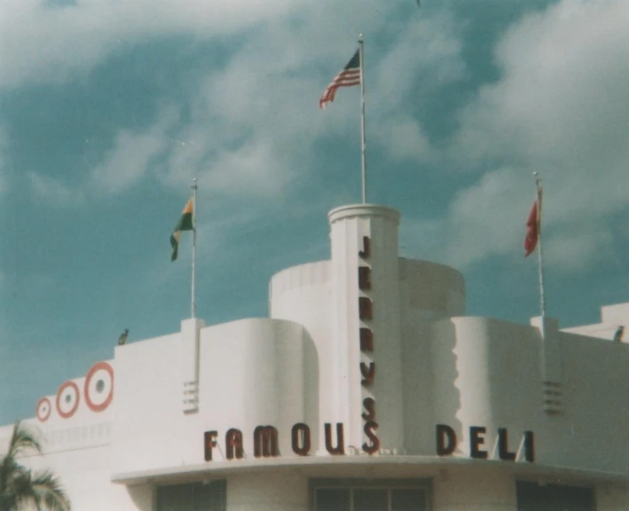 the front side of a theatre looking building