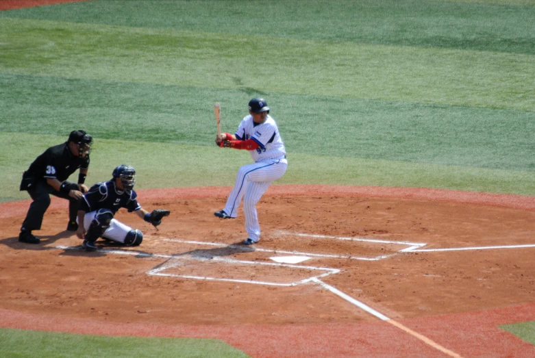 a batter is up to plate and ready to swing at the baseball