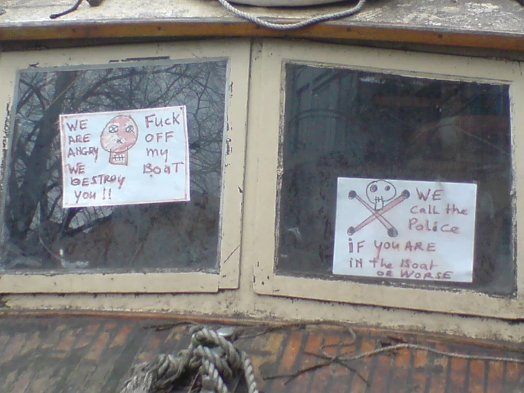 some political papers stuck to the windows of a building