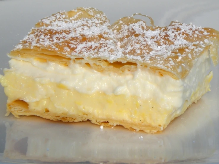 a pastry with some powdered sugar on top